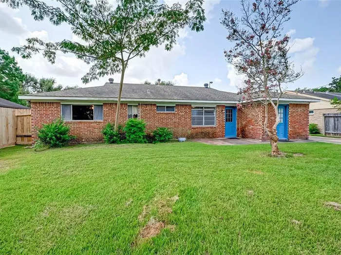 There is a backyard with a detached, two-car garage.