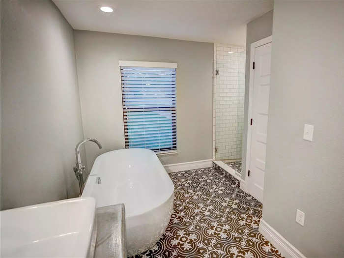 The bathrooms in the house have a clean finish, especially in the master bathroom.