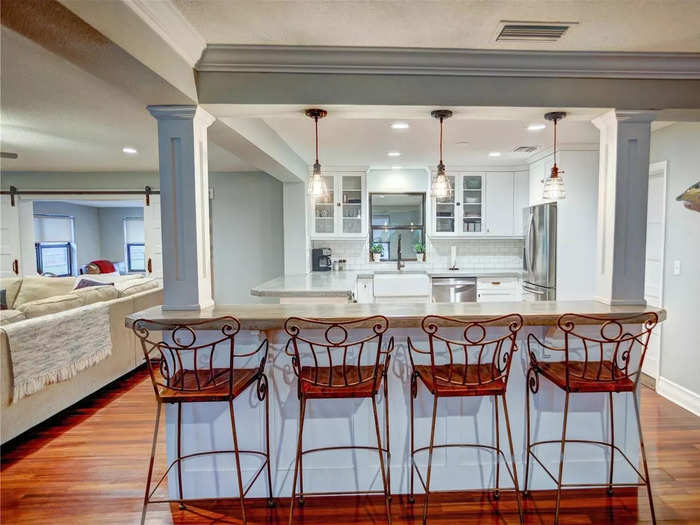 In the house, the kitchen has been updated with concrete countertops.