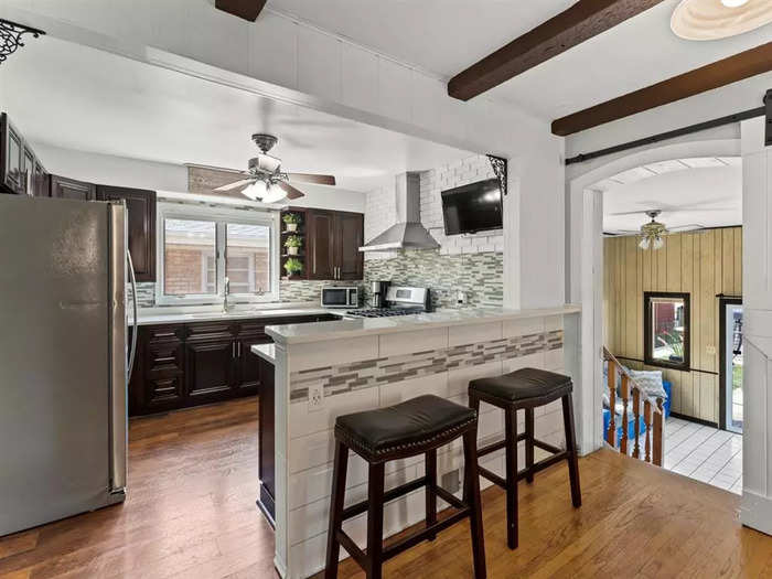 The kitchen has been completely renovated with stainless-steel appliances.