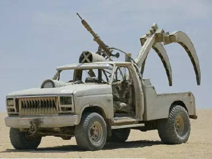 Formerly a F250 tow truck, the Sabre Tooth claw car sports a harpoon a pair of steel spikes to bite into the earth and bring a target