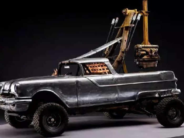 A 1956 Pontiac Custom Safari 2-door wagon is the platform for the 20-foot attack pole that made for one of the more acrobatic assaults in cinematic history - a wasteland Cirque du Soleil.