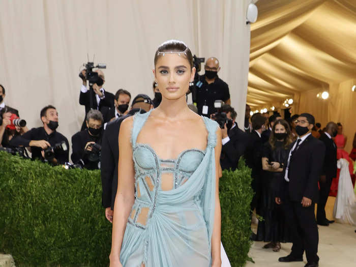 Taylor Hill went for a sexy dress with perfectly placed cutouts and a draped sheer skirt.