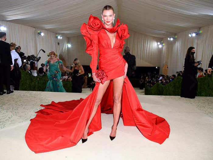 Karlie Kloss wore a red high-cut Carolina Herrera petal dress.