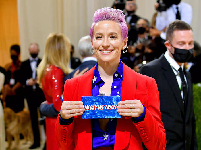 Megan Rapinoe carried a clutch emblazoned with the message "In Gay We Trust."