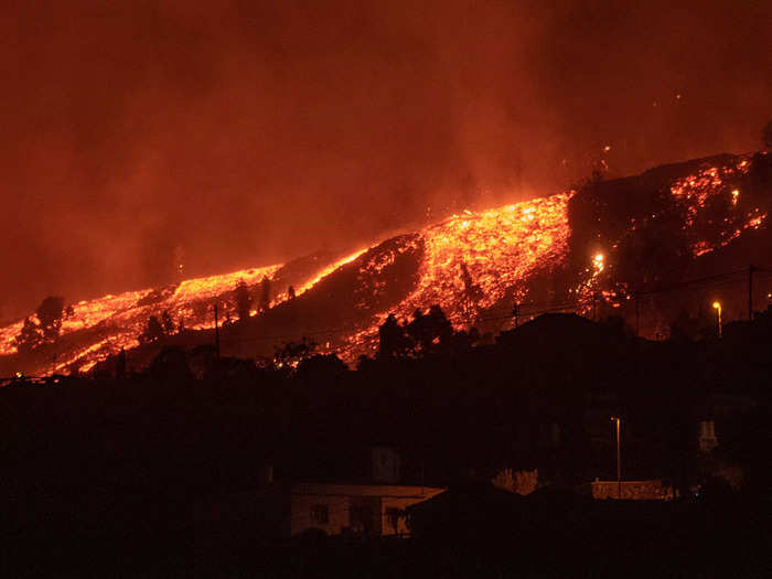 By nightfall, bright orange molten trails enveloped the hillside.