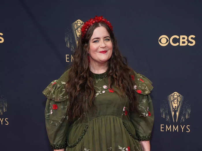 Aidy Bryant paired a floral dress with a red purse made from beads.