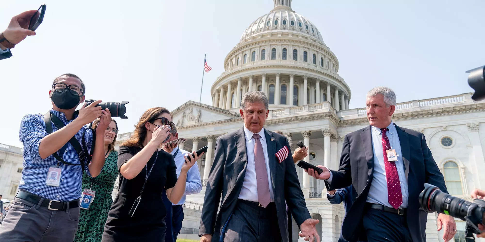 Sen. Joe Manchin, D-W.Va., speaks with reporters as he leaves a Congressional Remembrance Ceremony marking the 20th anniversary of the Sept. 11, 2001, terrorist attacks, on Capitol Hill in Washington, Monday, Sept. 13, 2021