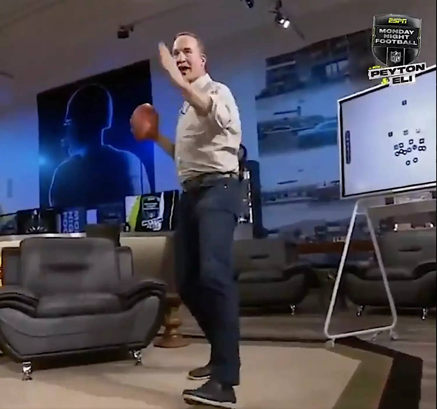 Screenshot shows Peyton Manning demonstrating how he threw a football.
