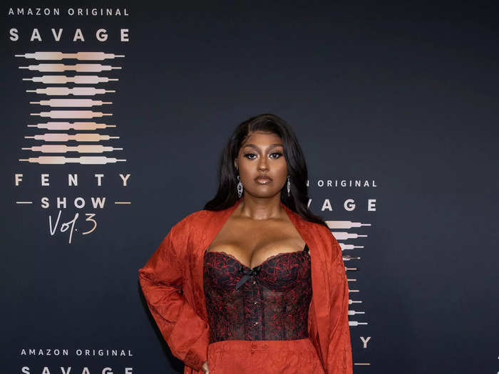 Jazmine Sullivan looked ready for business in a black-and-red corset top, which she paired with red pants and a long duster jacket.