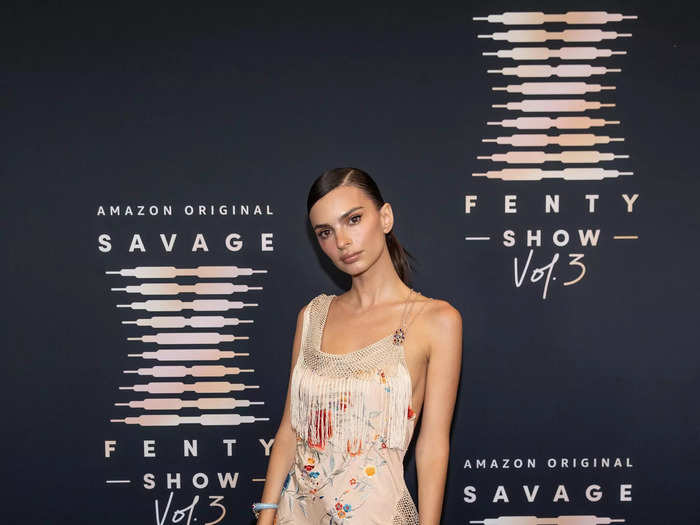 Emily Ratajkowski walked the Savage X Fenty red carpet in a floral dress that had tassels and a daring slit.