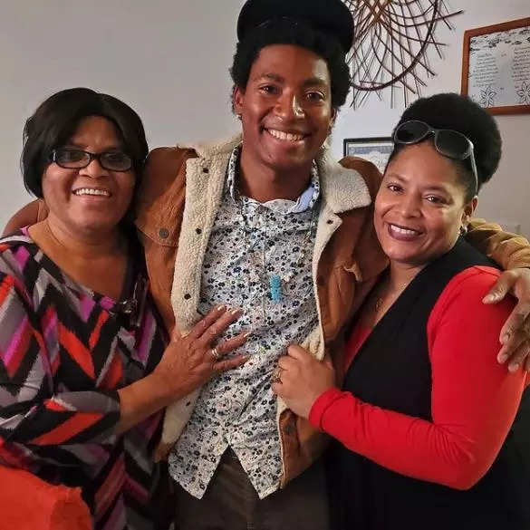 Daniel Robinson with his mother and grandmother