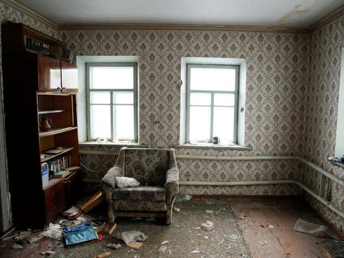 Disused furniture sits in an abandoned apartment in the Oktyabrsky district in Donetsk, Ukraine.