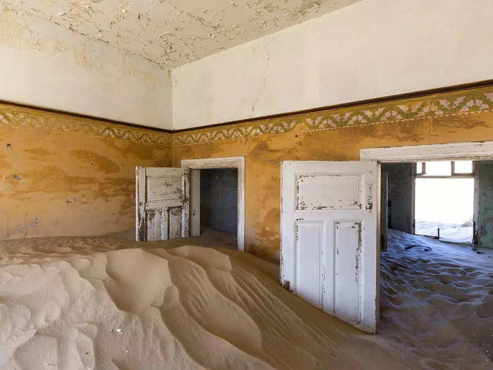 The German-influenced African village of Kolmanskop in Namibia was a bustling mining town in the early 1900s.