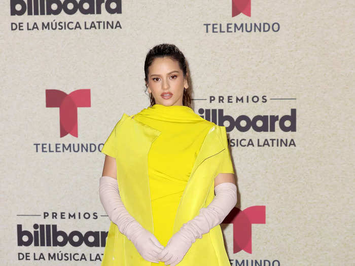 Rosalía turned heads in this stunning Valentino dress with a matching jacket and pink gloves.