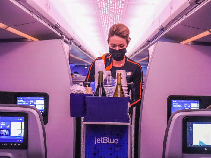 Flight attendants walked up and down the aisle to perform the in-flight service, just like a normal flight. It took a bit longer than it should have but that was chalked up to it being the very first flight.