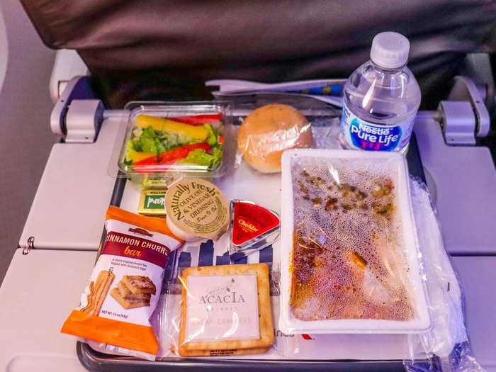 Next came the meal service as flight attendants quickly passed out the trays. I felt like I was being served in a cafeteria as one flight attendant curtly asked, "chicken or pasta?"