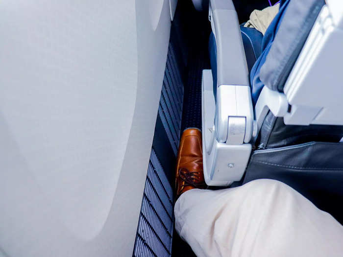 There was a gap between the seat and the cabin wall which offered some additional legroom and a place to store the pillow and blanket kit left on the seat.