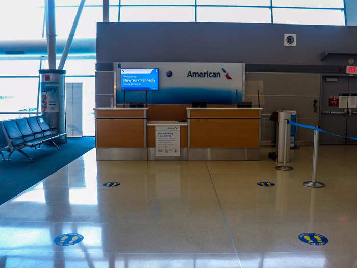 Pandemic-era safety measures including social distancing floor placards and plexiglass portions at the gate counter were still on display.