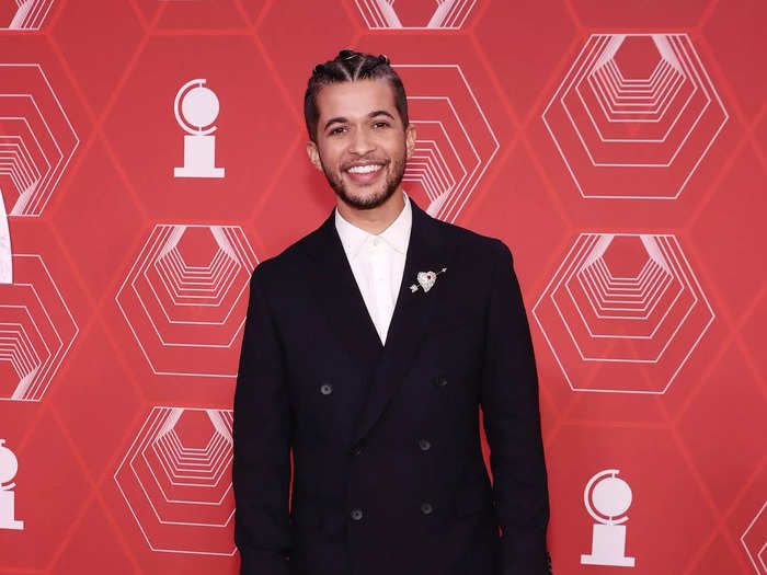 Jordan Fisher looked dapper in a classic suit and white button-up designed by Boss.