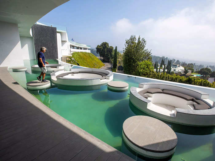 Another pool functions as a floating lounge.