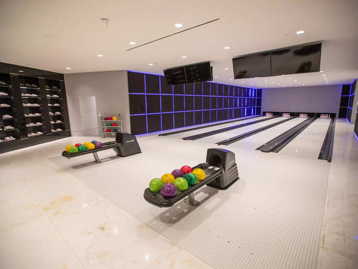 It has four lanes, several shelves of bowling shoes at the ready, and bowling balls oddly evocative of Trix cereal.