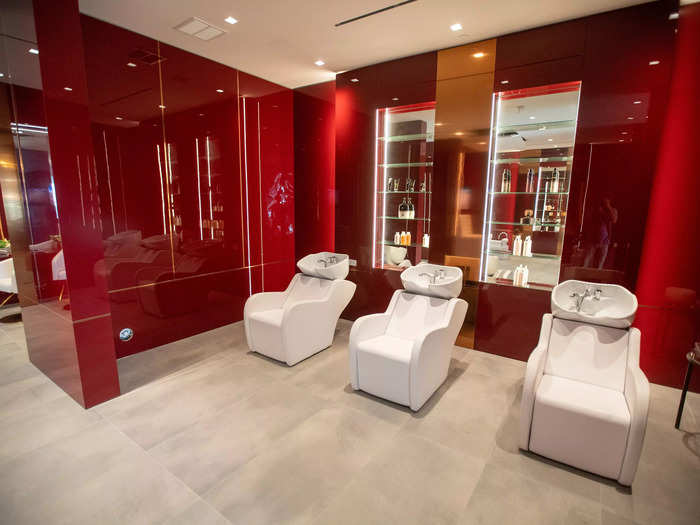 The salon seems to be one of the more vibrantly colored rooms in the mansion, with glossy red walls.