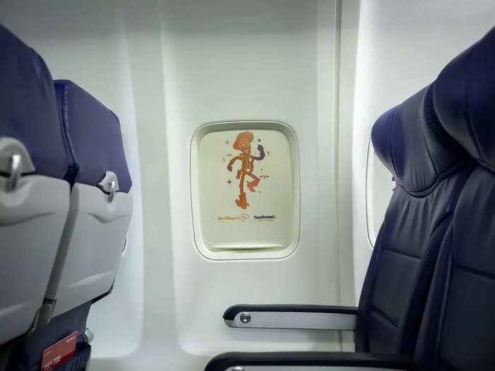 Disney was also brought inside the cabin of the aircraft. The window shades are lined with beloved characters like Woody...