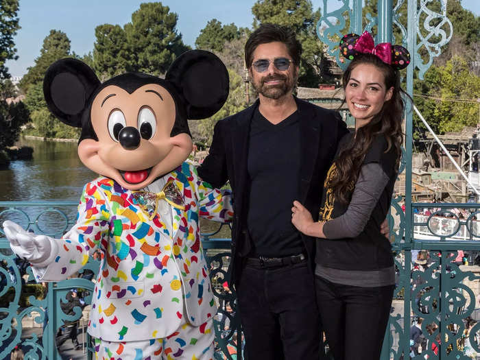 John Stamos has never been shy about his love for all things Disney - he even proposed to his wife, Caitlin McHugh, at Disneyland.