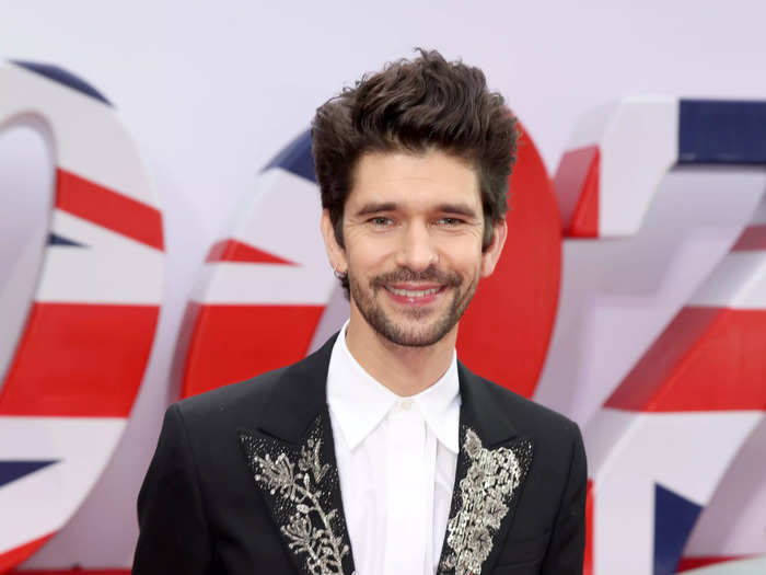 Ben Whishaw, who plays Q, graces the red carpet with a black suit with an ornate lapel.