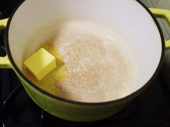 I started off by melting a few tablespoons of unsalted butter in a pot on the stove.