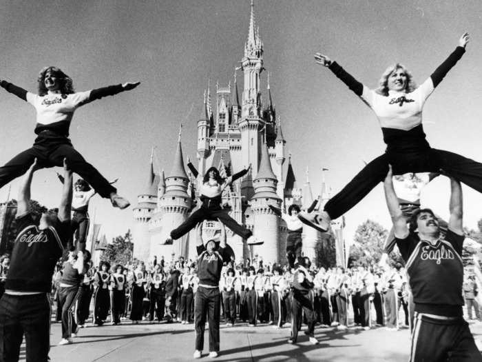 We can think of nothing cheerier than seeing Boston College cheerleaders perform in front of Cinderella Castle in December 1982.