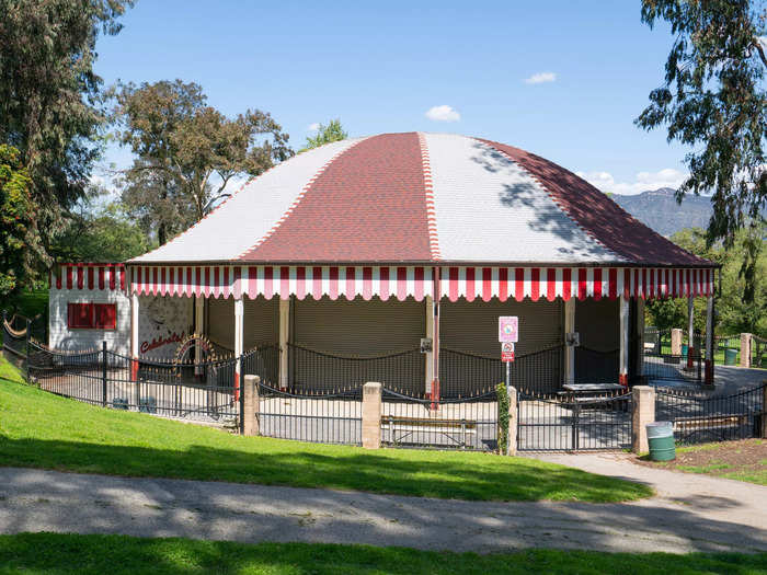 Walt Disney thought of the idea of Disneyland while sitting on a park bench watching his daughters ride a merry-go-round.