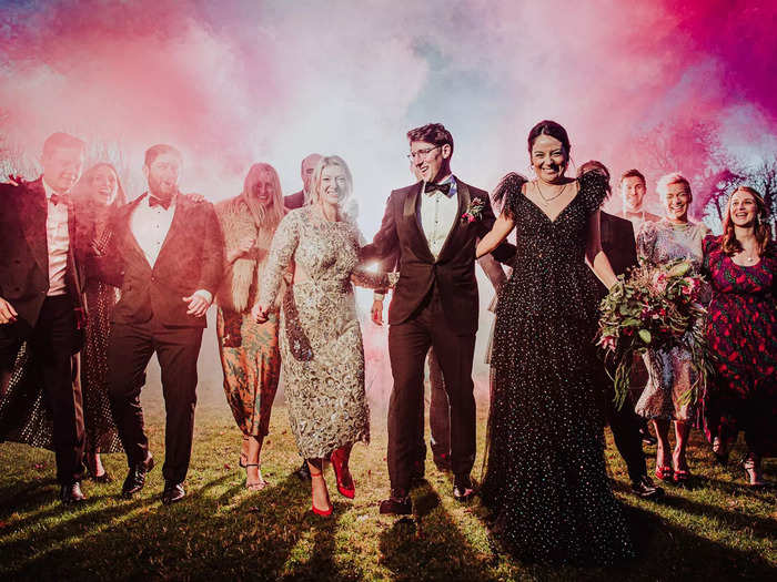 The newlyweds and their guests had fun with smoke bombs at the wedding.