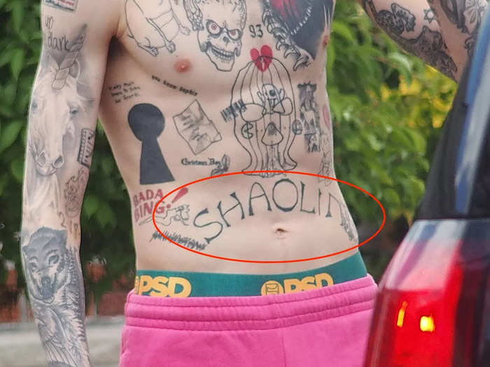 The word "Shaolin" is tattooed on Davidson