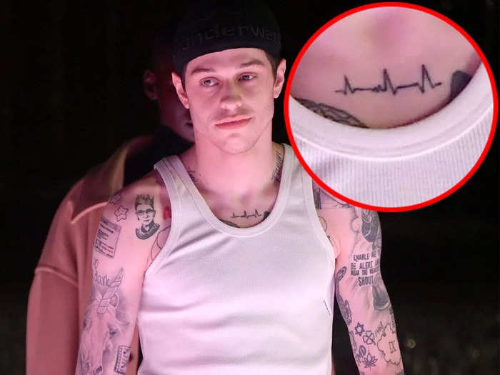 He has an electrocardiogram graph on his collarbone.