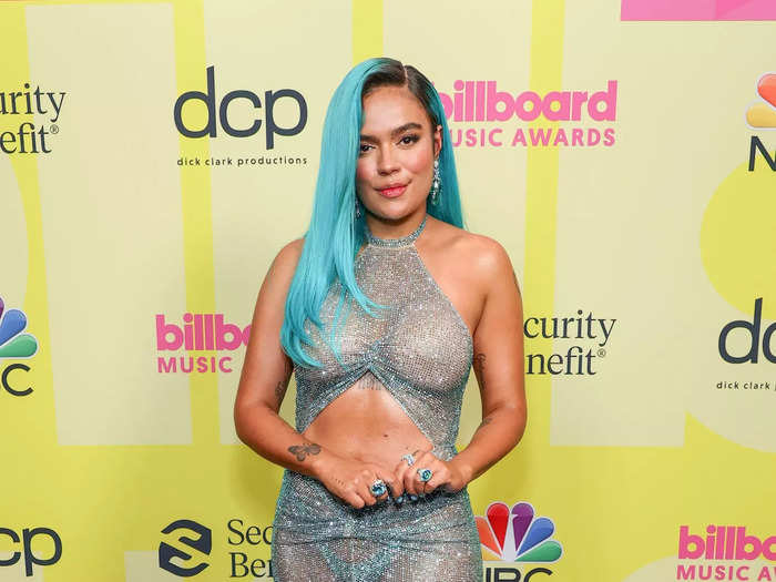 Karol G. also wore a see-through look to the 2021 Billboard Awards, opting for a sparkly Celia Kritharioti dress that was completely sheer, had a stomach cutout, and a daring slit.