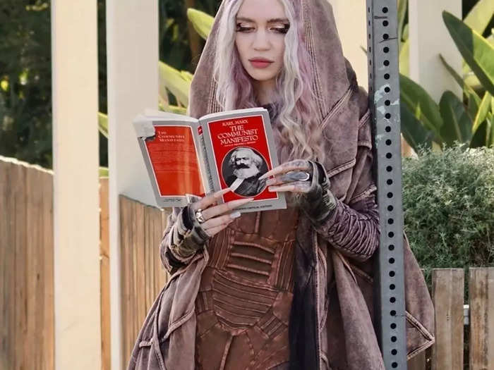 Days after their breakup was announced, Grimes was photographed reading "The Communist Manifesto."