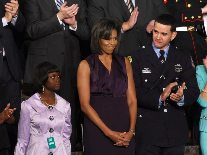 Michelle Obama wore a sleeveless purple dress for her husband