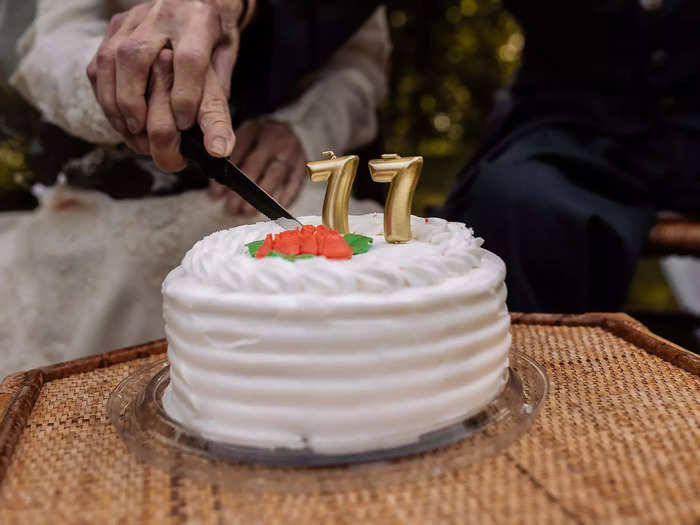 They also took a classic wedding photo of a ceremonial cake cutting.