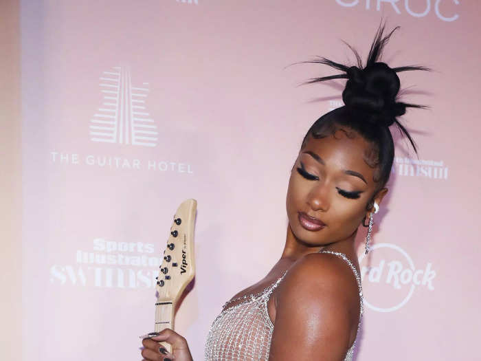 Megan Thee Stallion dazzled in a partially sheer Natalia Fedner dress at the 2021 Sports Illustrated Swimsuit Issue party.