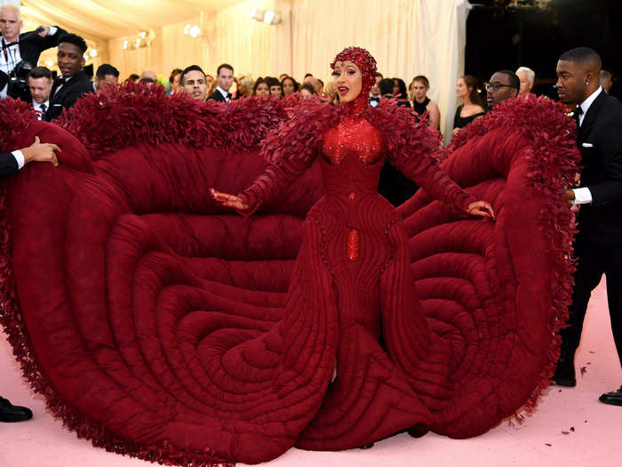 Cardi B stunned at the 2019 Met Gala in a custom-made blood red Thom Brown gown.