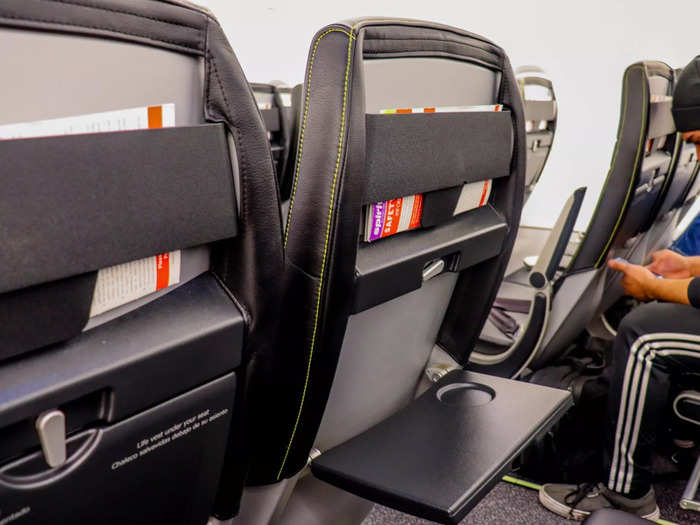 There are no adjustable headrests, seat-back entertainment systems, in-seat power outlets, or even seat-back pockets.