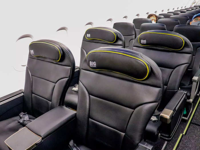 The first two rows, however, house "big front seats" that are essential business class-style recliners without the business class perks. These seats offer 36 inches of pitch and 20 inches of width, with a wide center console and adjustable headrests.