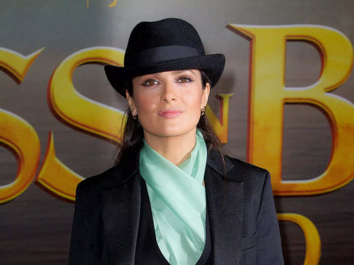 She wore a three-piece suit and black fedora to the UK premiere of her film "Puss in Boots" on November 24, 2011.