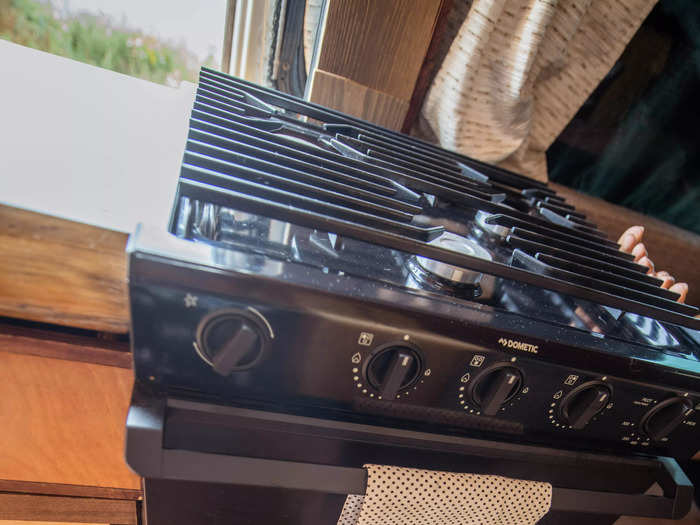 Below the stove, a drawer pulls out that stores Rodriguez