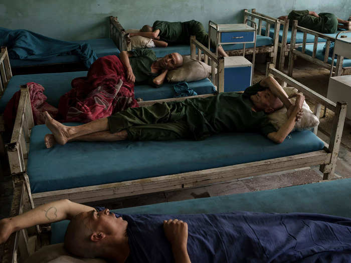 Drug users detained during a Taliban raid rest at the detoxification ward.