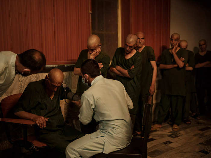 Patients wait to have medical checks as they arrive at the detoxification ward.