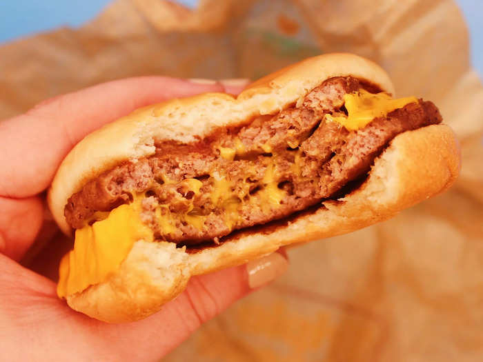 Each patty came coated in gooey cheese, while pickles, onions, ketchup, and mustard added even more flavor to the burger.