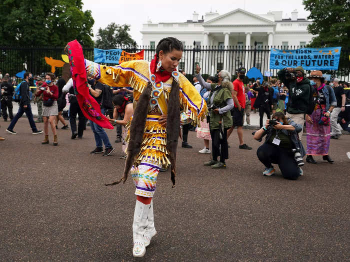 Protestors were seen singing, dancing, and praying in front of the White House.